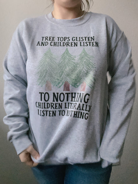 Gray sweatshirt with nature-themed text and graphics worn by a person. NWT Children Listen To Nothing Crewneck | Grace Thrifts