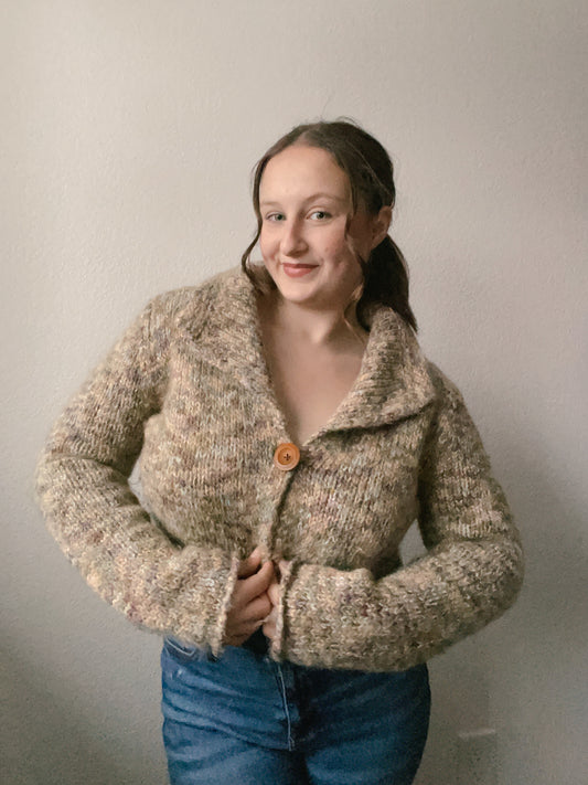 Person wearing a knitted beige cardigan with a plain background Cottage core Wool Cardigan | From the Rack | Grace Thrifts