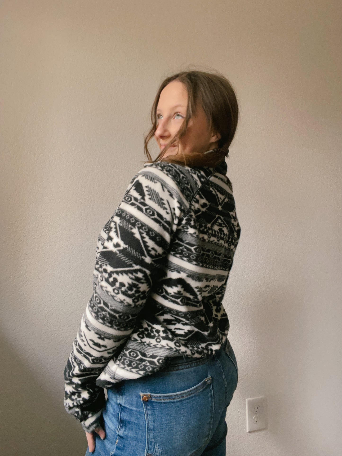Person wearing a black and white patterned pullover against a plain background B&W Eddie Bauer Pullover | From the Rack | Grace Thrifts