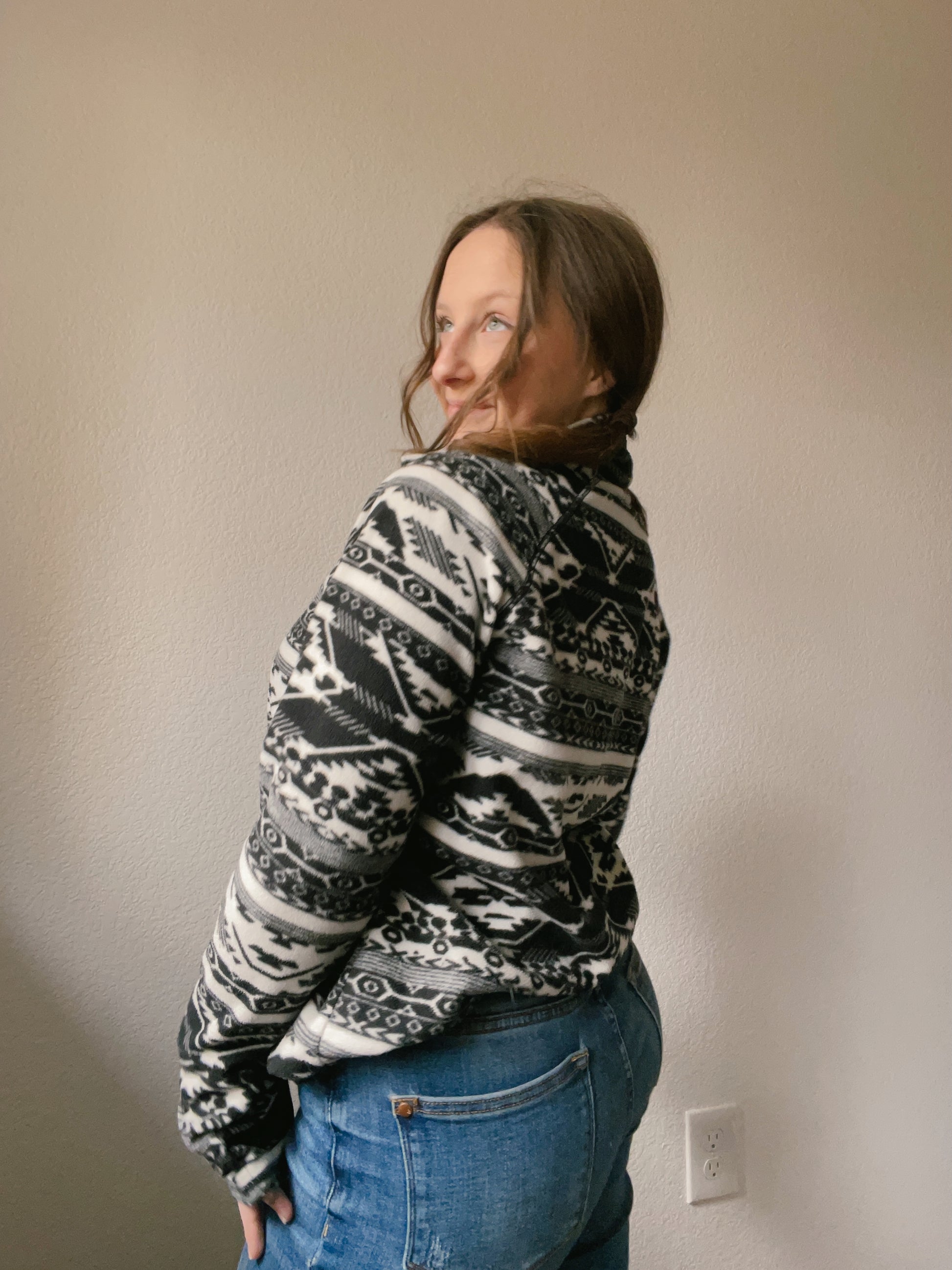 Person wearing a black and white patterned pullover against a plain background B&W Eddie Bauer Pullover | From the Rack | Grace Thrifts